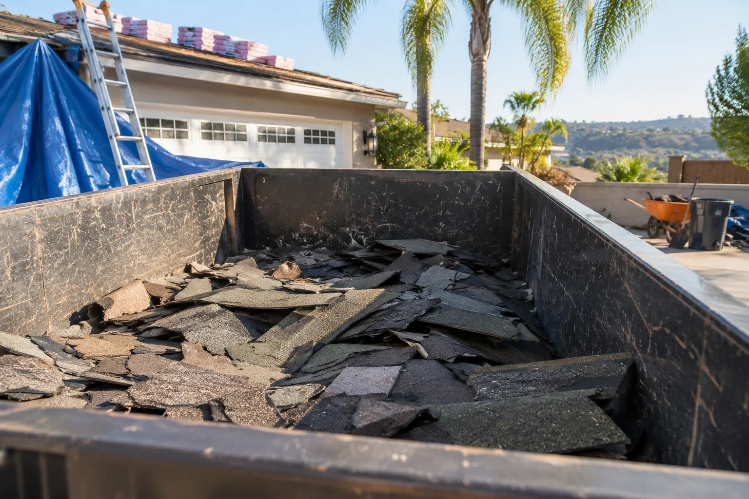 Roofing shingles kept below a dumpster fill line